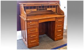 Early 20th Century Oak Tambour Roll Top Desk, the front opening to reveal drawers and pigeon holes,