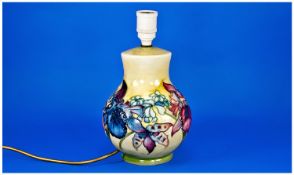 Moorcroft Lamp Base `Orchids Design` on yellow ground, Moorcroft marks to base. Stands 10.25 inches