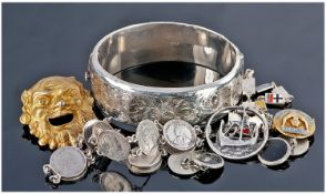 Small Lot Of Silver Jewellery Comprising Hinged Bangle, Mask Brooch, Coin Bracelet, Badge, Bracelet