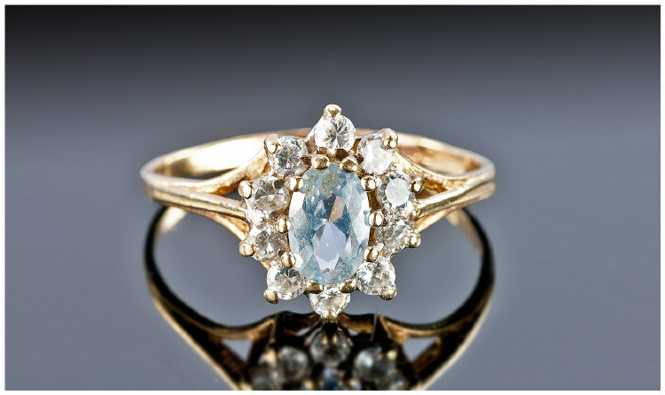 9ct Gold Dress Ring, Set With A Central Blue Stone Surrounded By Round CZ`s, Fully Hallmarked.