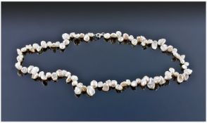 White Freshwater Keshi Pearl Necklace, single strand fastened with a sterling silver lobster claw