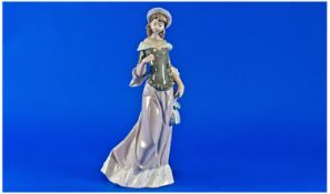 Lladro Figure `Elegant Lady`, model no 5003, issued 1980`s. 10.5 inches high.