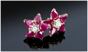 18ct Gold Set Ruby And Diamond Earrings, Each Set With A Central Round Modern Brilliant Cut Diamond