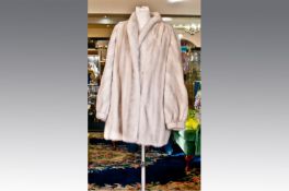 Platinum Mink Long Jacket, luxurious skins overall, the fronts are slightly pleated into a narrow