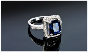 14ct White Gold Sapphire & Diamond Ring, Set With A Central Emerald Cut Sapphire (Estimated Weight