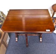 Late Victorian Mahogany Sutherland Table, raised on simple turned legs, measuring 25 inches high.