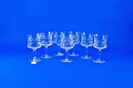 Set of Seven Cut Glass Drinking Glasses, waisted bowls, raised on slender tapering stems, star cut
