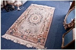 Small Woolen Rug, symmetrical floral patterned border on a grey ground, fringe edge, 71 by 36