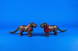 A Pair Of Unusual Bronze Patinated Iron Dog Nutcrackers. The tail is the handle. Patent number