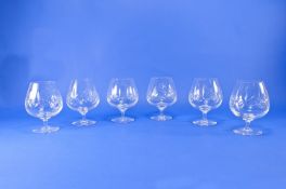 Set of Six Cut Glass Brandy Glasses, raised on slender stems.