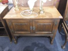 Old Charm Linenfold Oak Radio Cabinet, the linenfold panelled doors opening to reveal open space to