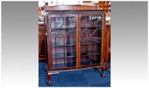 Early 20th Century Mahogany Glazed Bookcase / Display Cabinet, of bow fronted form, the top frieze