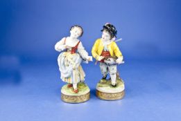 Pair of Rudolstadt Volkstedt Country Figures, girl with castanets, dancing, whilst the boy plays a
