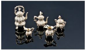 Silver Five Piece Miniature Tea Service Comprising Spirit Kettle, Coffee Pot, Hinged Sugar And Two