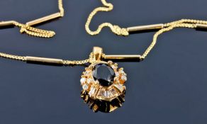18ct Gold Sapphire And Diamond Pendant, Central Dark Blue Sapphire Surrounded By Tapered Baguette