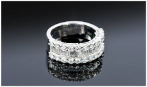 18ct Gold Diamond Ring, Set With A Central Row Of Baguette Cut Diamonds Between Two Rows Of Round