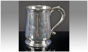 A Silver Tankard of plain form raised on a reeded base, hallmark London, approx 13 onz, 5 inches