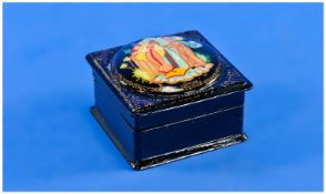 A Hand Painted Russian Black Lacquer Box. Square Form with a raised roundel to the hinged lid and