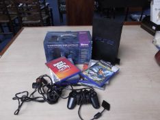 Playstation 2 Console plus memory card in good working order. Hi performance controller multi tap