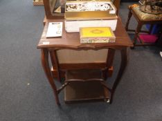 Early 20th Century Two-Tier Occasional Table, raised on shaped legs, 28¾ high, 23 wide and 15 deep.