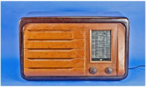 A Rare Bakelite Radio, in two tone brown hues to the front. Makers name Masteradio ltd. Model D111,