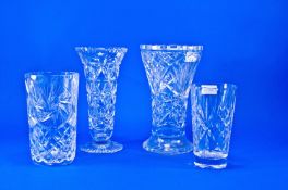 Four Various Cut Glass Vases, comprising trumpet shaped vase, two tapering vases and a further