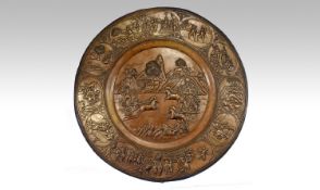 an 18th/19th Century Burmese/Thai brass wall rounded plaque, finely embossed repouse worked.