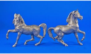 A Good Pair Of Silvered Metal Figures Of Prancing Horses Circa 1960`s. Each stands 5.5`` in height.