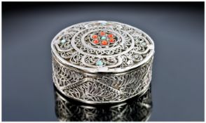 An Oriental White Metal Round Box with Removable Lid. The lid set with small coral and turquoise