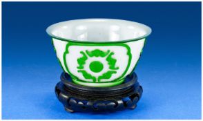 A Chinese Peking Glass Bowl, with single jade - green carved overlay. Diameter 11.3 cm