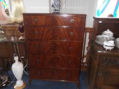 Mahogany Chest of Drawers, comprising five long graduated drawers, all with flame mahogany veneered