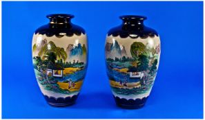 Japanese Satsuma Pair of Vases, circa 1900. Decorated with figures in a landscape, signed to base.