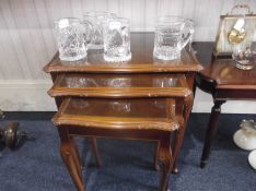 Nest of Three Tables, walnut veneered tops, glazed, highest 21 inches.