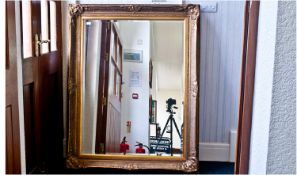 Large 20th Century Gilt Framed Wall Mirror, fitted with bevelled edge glass, measuring 59 inches