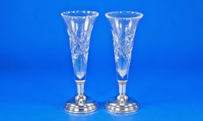 A Pair of Cut Crystal Rose Vases. Supported on a circular stepped silver bases. Hallmarked