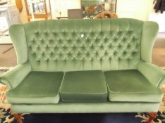Traditional Green Two Piece Suite, comprising three seater settee and wing chair, each with deep