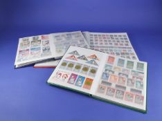 Three Stock Books of all World Stamps, Mostly mint and in very good condition.