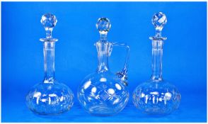 Pair of Late Victorian Glass Decanters, of shaft and globe form, each with multi-faceted stoppers,
