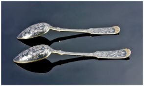 A Superb Pair of Mid 19th Century Russian Silver Gilt and Niello Spoons. The reversev and the front