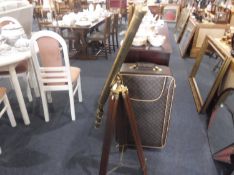 Modern Brass Telescope, raised on an adjustable tripod stand.