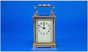 French Brass Carriage Clock c 1900 with visible escapement, enamel dial and standing 5.5 inches