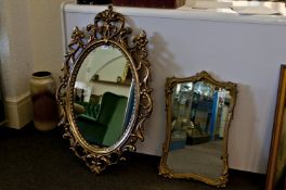Two Decorative Gilt Framed Mirrors, one oval and one rectangular.