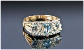 Ladies 9ct Gold Set 3 Stone Aquamarine and Diamond Ring. The aquamarine of good colour with diamond