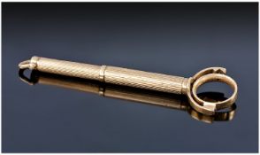9ct Gold Dunhill Cigar Piercer, Engine Turned Form With Spring Action, The Terminal Formed As A