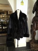 Brown/Black Mink and Black Leather Jacket, the mink in diagonal strips forming chevrons to the