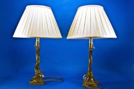 Pair of Contemporary Brass Table Lamps, fitted with cream pleated shades, measuring 22 inches high,