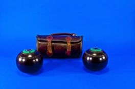 Set of Crown Bowls in leather case.