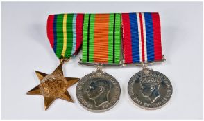 Group Of Three WW2 Medals Fitted On A Metal Bar.