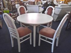 Contemporary White Circular Dining Table and Four Chairs, each with pink upholstered backs and