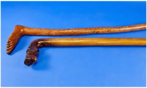 Two Novelty Walking Sticks, One Late 19thC The Handle Modelled In The Form Of A Human Foot A/F (